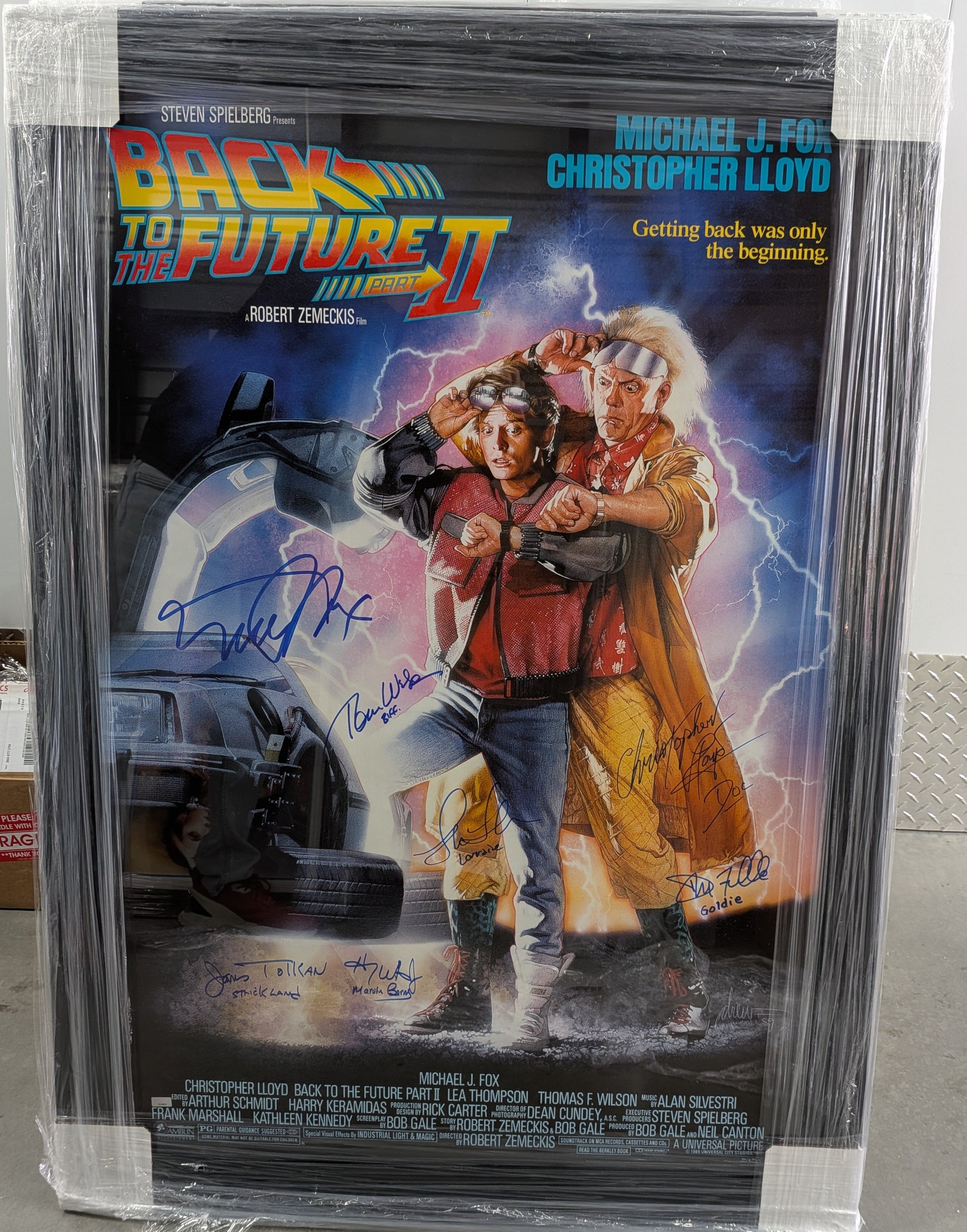 Back to the Future Part II Cast Signed 27x40 Movie Poster in Studio-grade Frame – Michael J. Fox, Christopher Lloyd & Ensemble | Celebrity Authentics Certified
